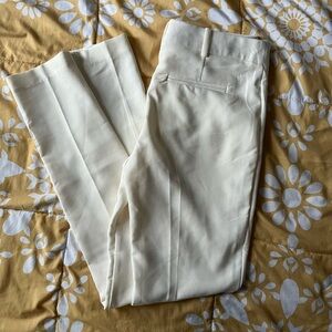 Cream colored skinny trousers